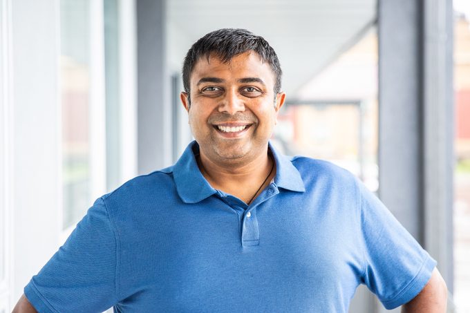 Owner Sean Patel poses for a photo at the Quality Inn in Kodak, Tenn.
