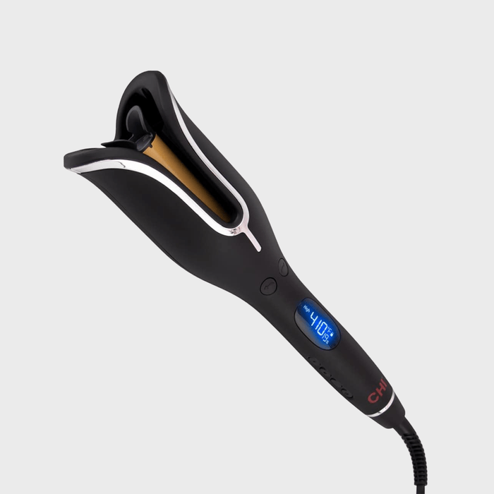 A black curling iron displays 