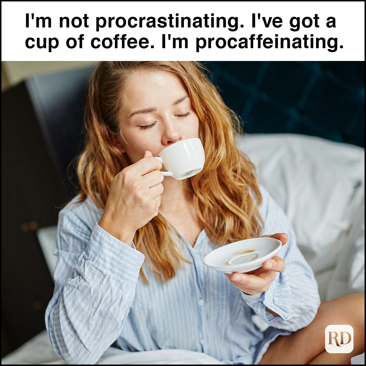 Woman having coffee in bed