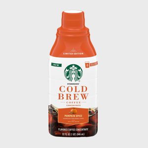 Bottle displays limited edition Starbucks cold brew concentrate, featuring pumpkin spice flavor. White background emphasizes orange cap and label with detailed product text.