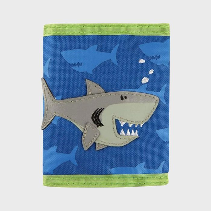 A gray shark illustration swims on a blue and green wallet, surrounded by smaller blue shark silhouettes.