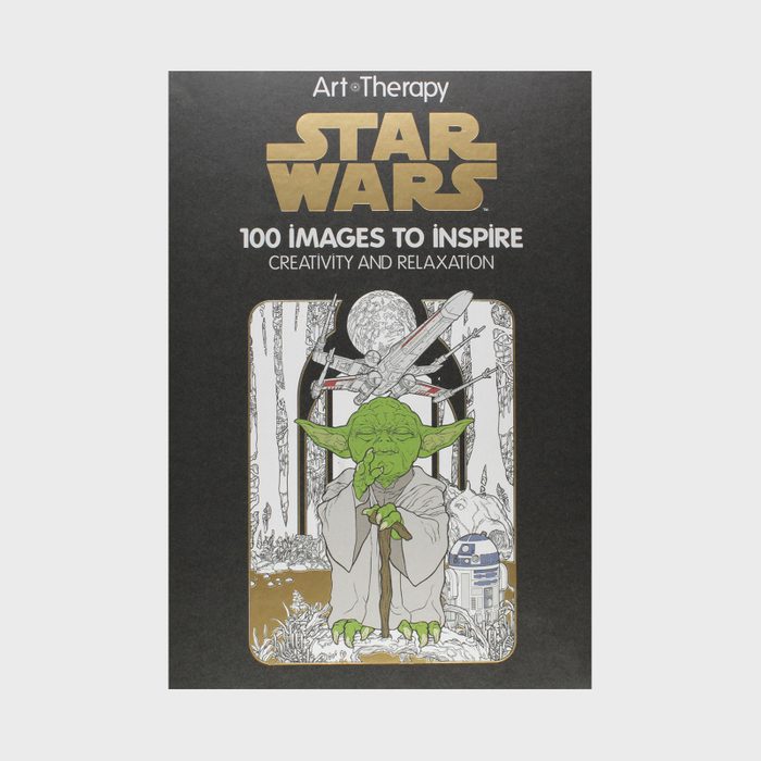 Yoda stands offering guidance, surrounded by a forest with spaceships overhead, on a 