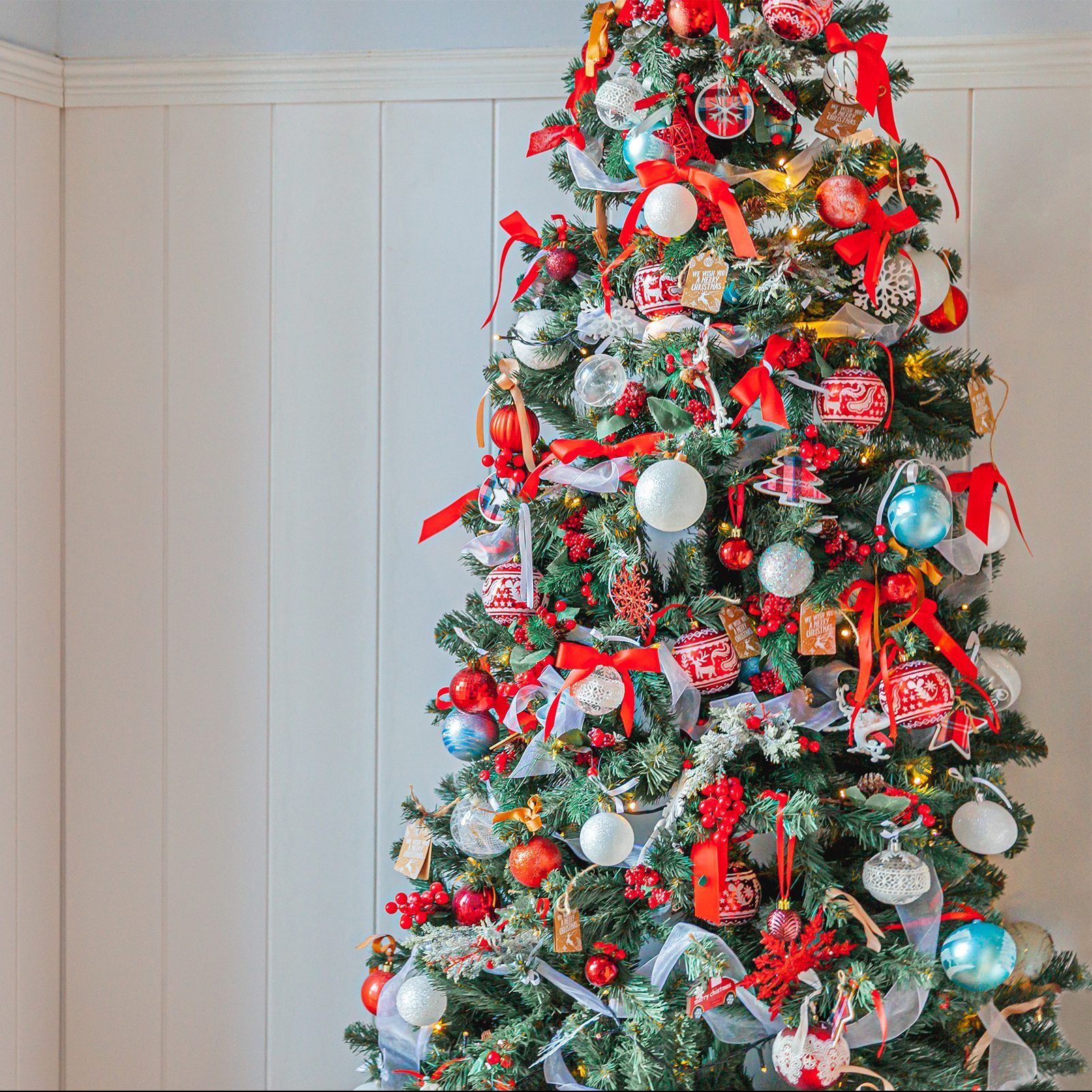 Classic Christmas New Year decorated New year tree with red and white ornament decorations toy and ball