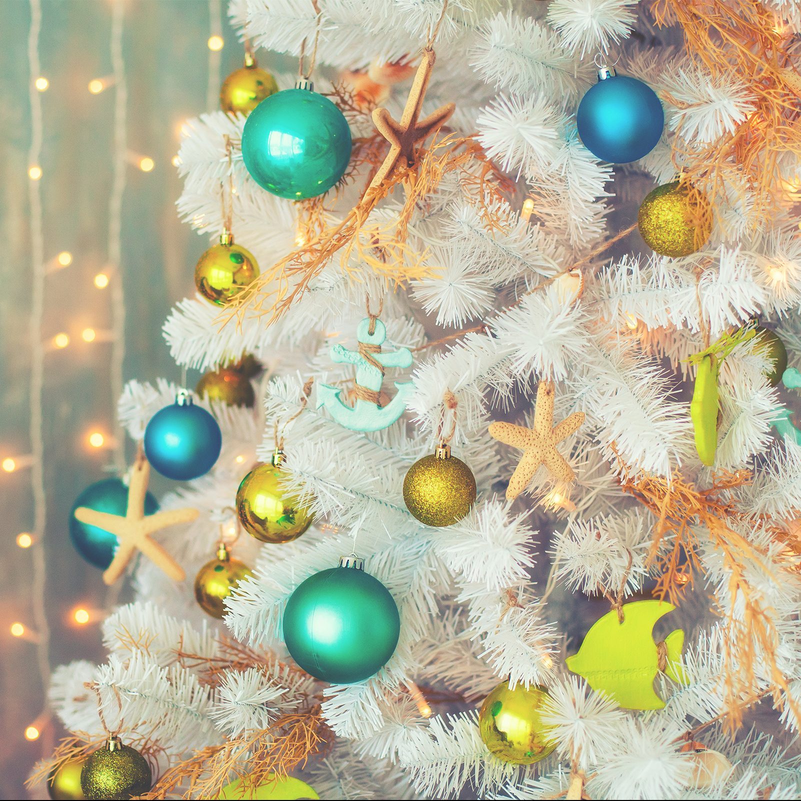 White decorative xmas tree with colourful balls, vintage toned, christmas