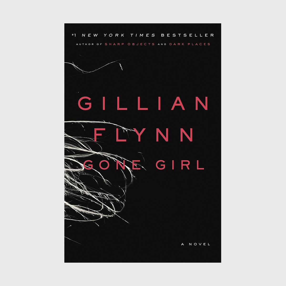 Book cover displays "Gillian Flynn GONE GIRL" in bold letters, features wispy white lines against a black background, indicating mystery or suspense.