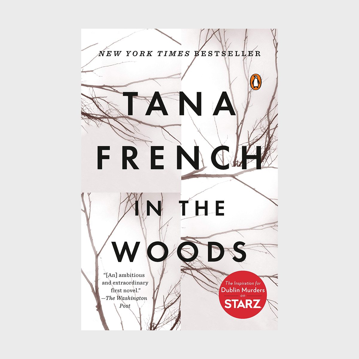 Book cover displays leafless branches intersecting, featuring bold text "Tana French In the Woods" on a white background, indicating "New York Times Bestseller."