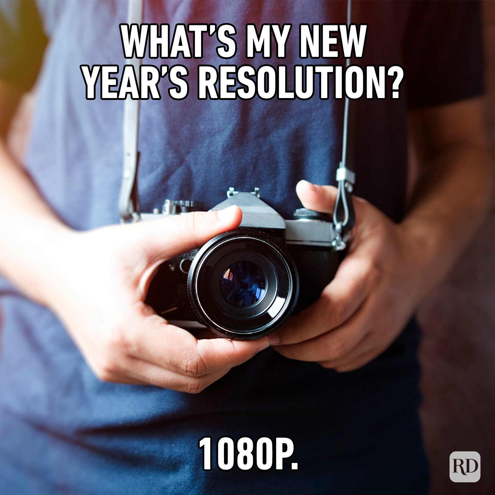 Young, Smiling Girl Looking At Her Reflection In The Mirror