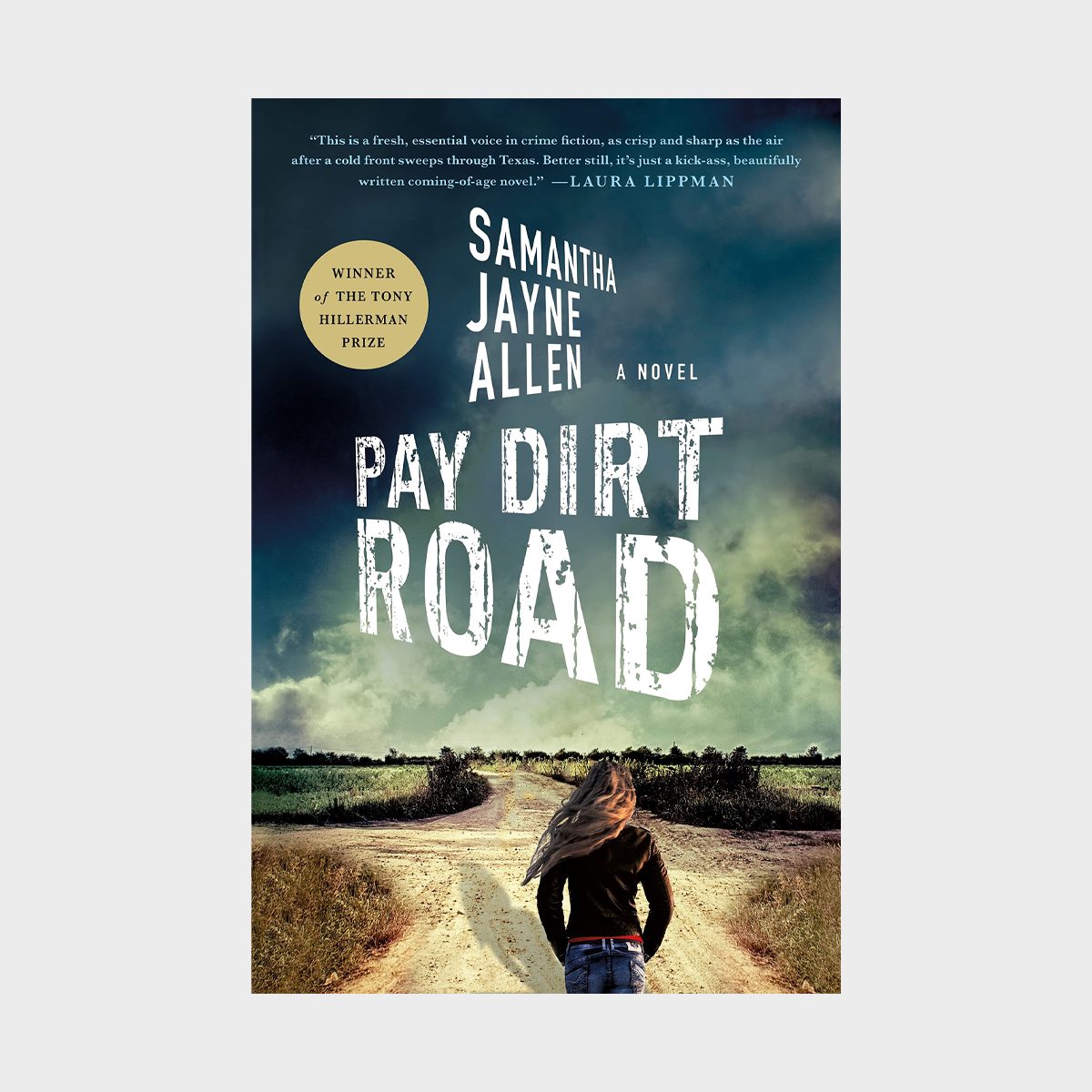 Person walks down a dirt road under a cloudy sky. Text reads: "Pay Dirt Road" by Samantha Jayne Allen, winner of the Tony Hillerman Prize.