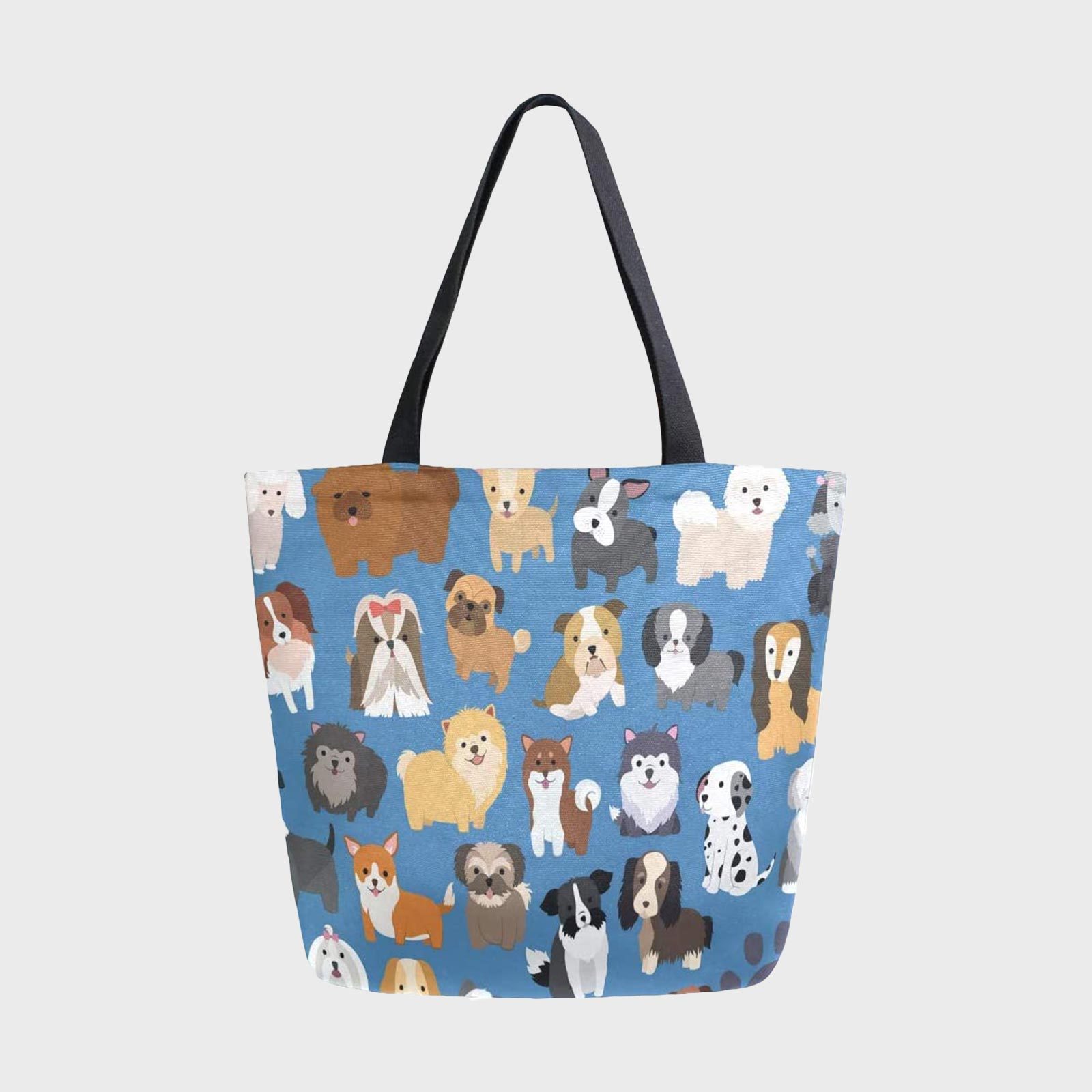 Tote bag features cartoon dogs, displayed in various breeds, on a blue background with black handles.