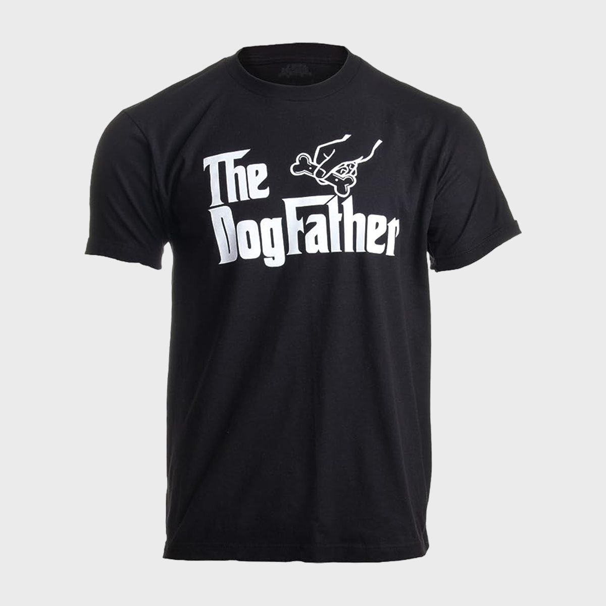 Black T-shirt displays phrase "The Dog Father" with a hand holding a bone, set against a plain gray background.