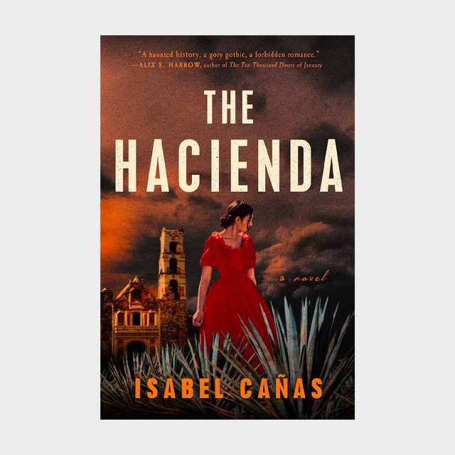 A woman in a red dress stands in front of an old hacienda under a stormy sky. Text: 