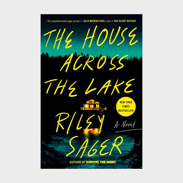 Book shows a glowing house reflecting on a lake at night; surrounded by trees with bright yellow text. 
