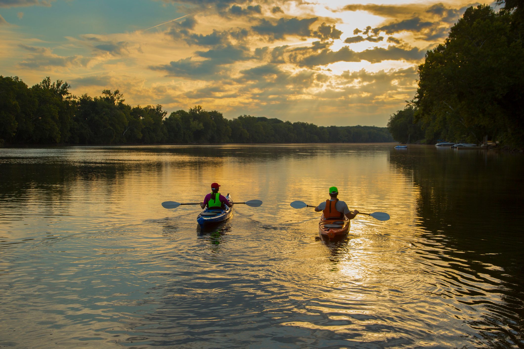 mother and son kayaking on vacation