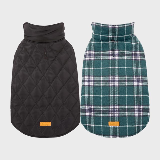 Two dog coats displayed side by side; one black quilted, one green plaid, both