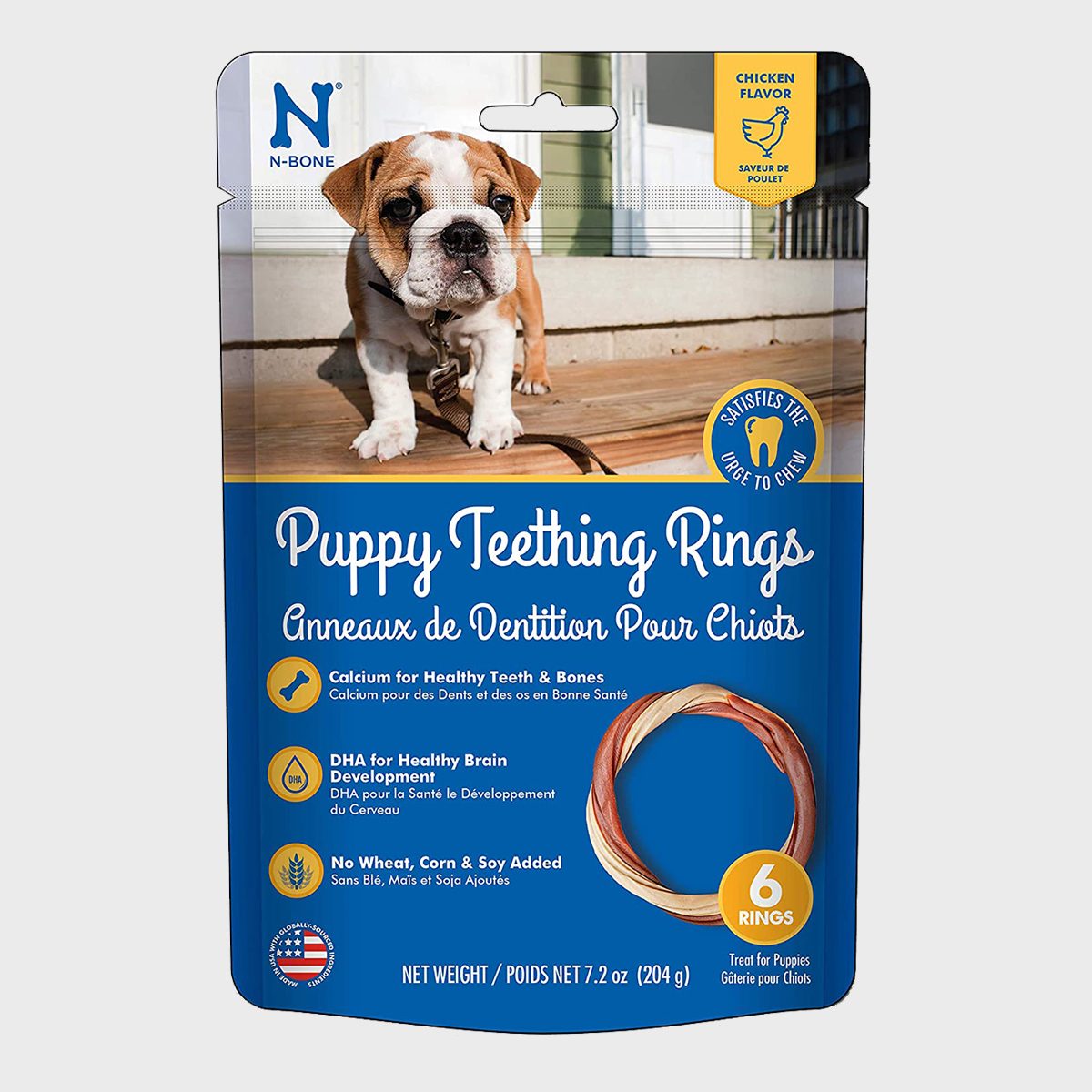 Packaging displays puppy teething rings, highlighted in blue, featuring a bulldog puppy and text detailing calcium benefits and ingredients. Six rings included, chicken flavor.