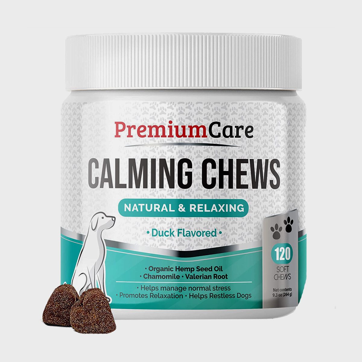 Jar labeled "Premium Care Calming Chews" sits with duck-flavored chews, promoting relaxation for dogs, featuring hemp seed oil, chamomile, valerian root.