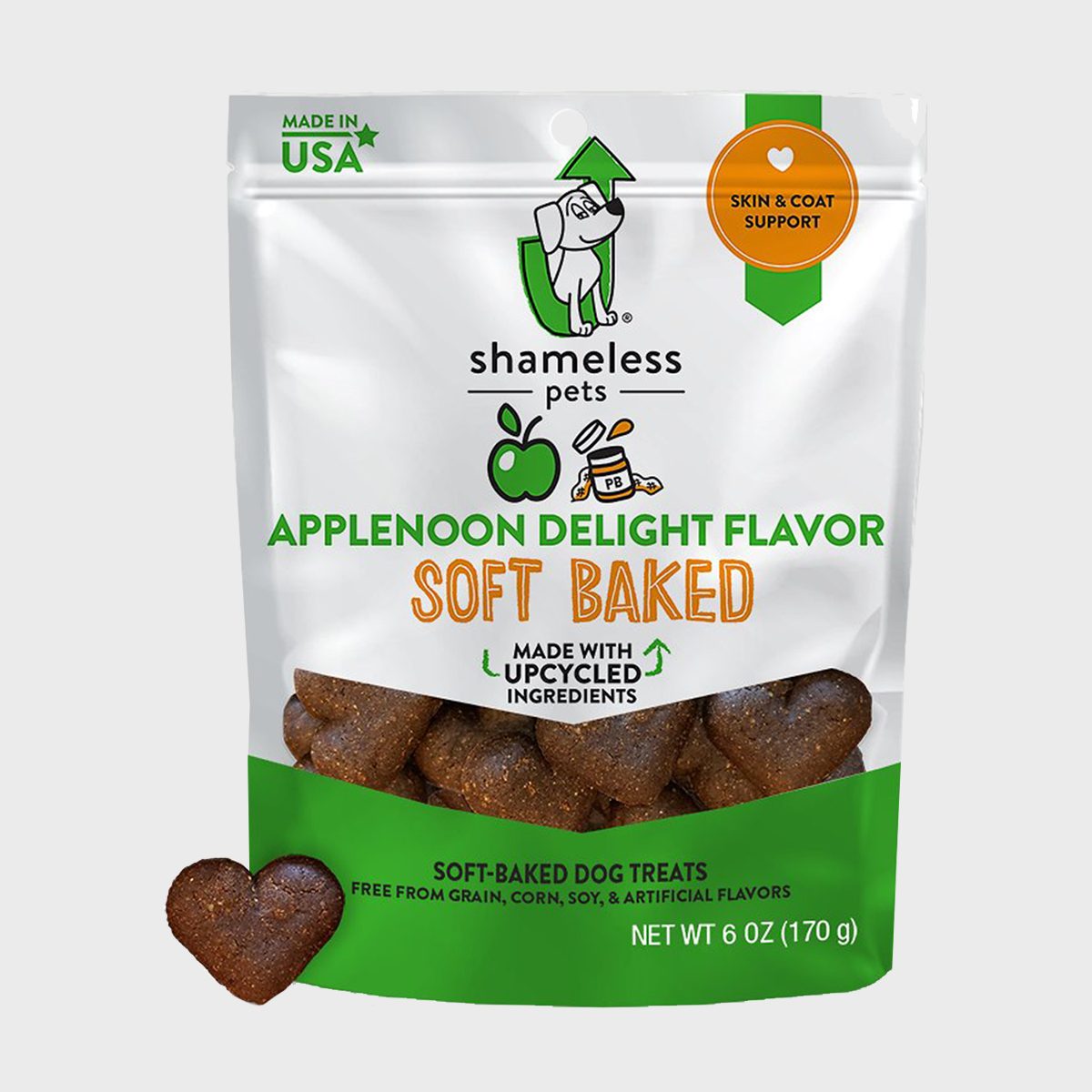 Dog treats, packaged in a colorful pouch, display "Applenoon Delight" flavor, highlighting upcycled ingredients and soft-baked texture, suitable for skin and coat support.