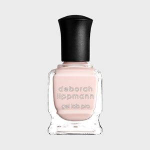 A bottle of nude nail polish labeled 