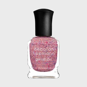 Nail polish bottle containing pink glitter polish, standing upright against a plain background. Text reads 