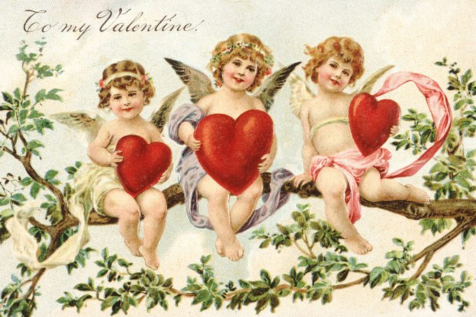 vintage valentine's day card with three cupids