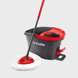 Mop rests next to a black and red bucket labeled 
