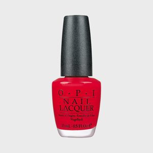 A red nail polish bottle stands upright, labeled 