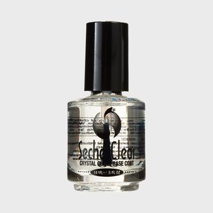 Bottle of clear nail polish stands upright, labeled 