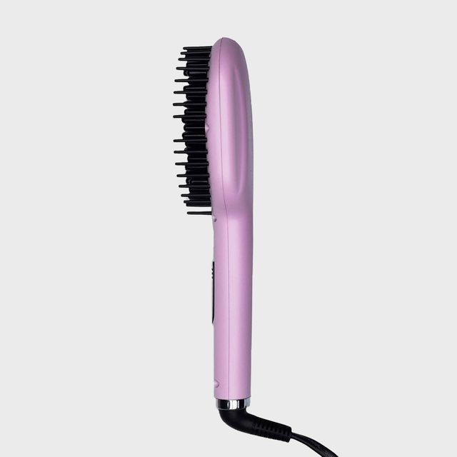 Pink hairbrush with black bristles, viewed from the side, connected by a cord, set against a plain gray background.