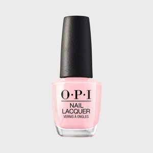 Pink nail polish bottle stands centered against a gray background, displaying text: 