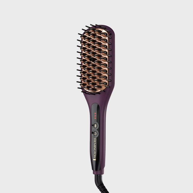 Heated hair straightening brush, featuring bristles and controls, lies on a plain white background. The brand 