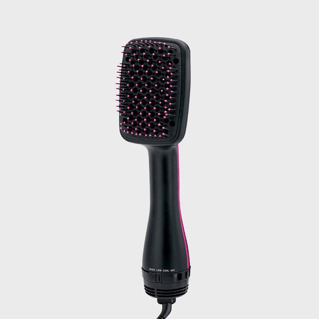 Brush, with pink-tipped bristles, stands vertically in a neutral background. Text on the handle reads 