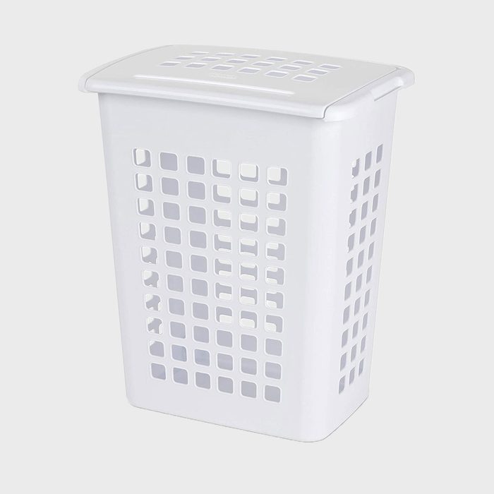 Plastic laundry hamper stands upright, features square perforations, set against a plain grey background.