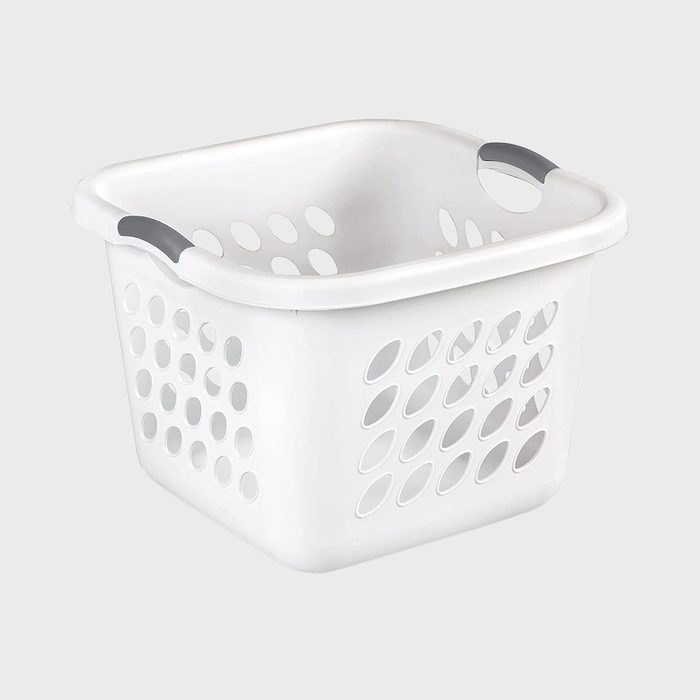 Basket with open handles sits empty, displaying oval ventilation holes against a plain gray background.