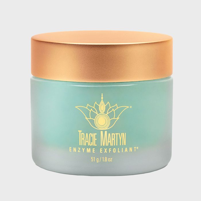 A frosted glass jar with a golden lid displays 