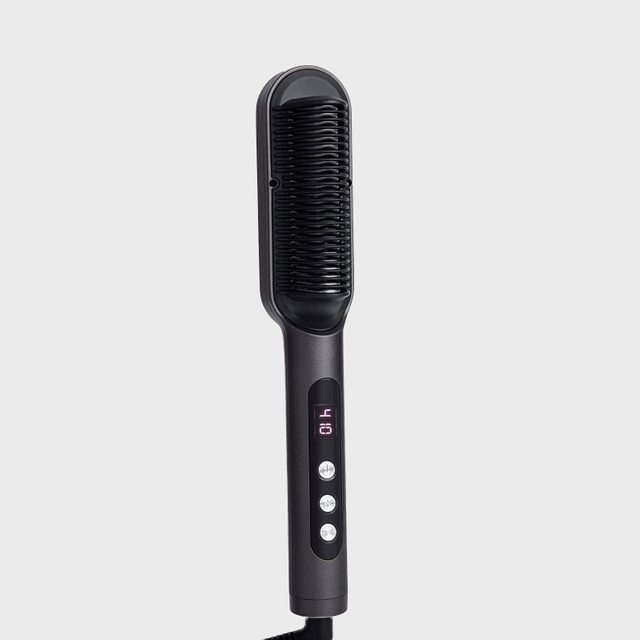 A black hair straightening brush with digital display, buttons visible, against a plain gray background.