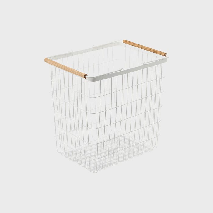 Wire basket stands upright with wooden handles, set against a plain white background.