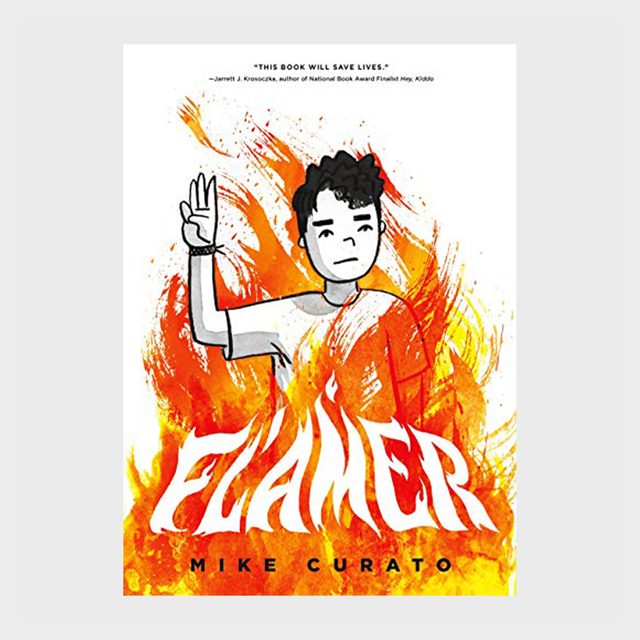 A boy stands surrounded by flames, holding three raised fingers. Text: 