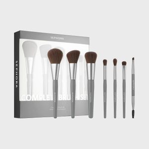 Brushes displayed arranged in a line; various sizes with gray handles. Box labeled 