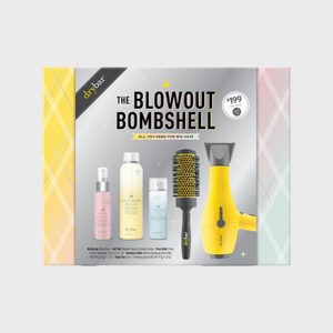 Hair styling kit features a yellow blow dryer, brush, and products against a patterned background, labeled 