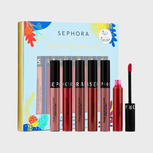 Lip stain set showcased with six vibrant colors, includes an open tube with applicator. Blue and yellow floral patterned box in background.