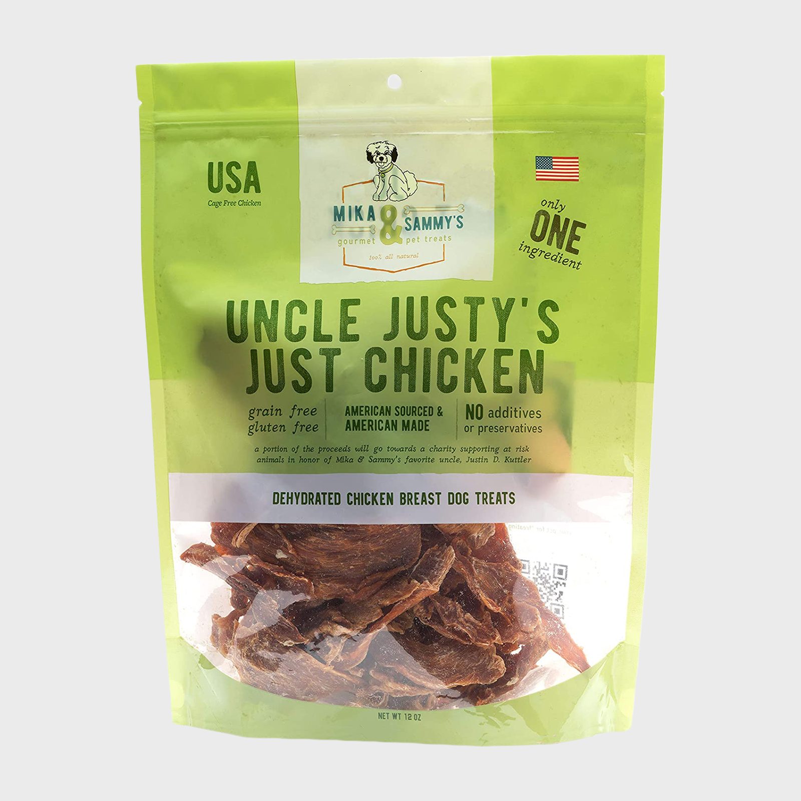 The dog treat package displays dehydrated chicken pieces; it is green with text emphasizing USA origin, grain-free, gluten-free, and no additives or preservatives.