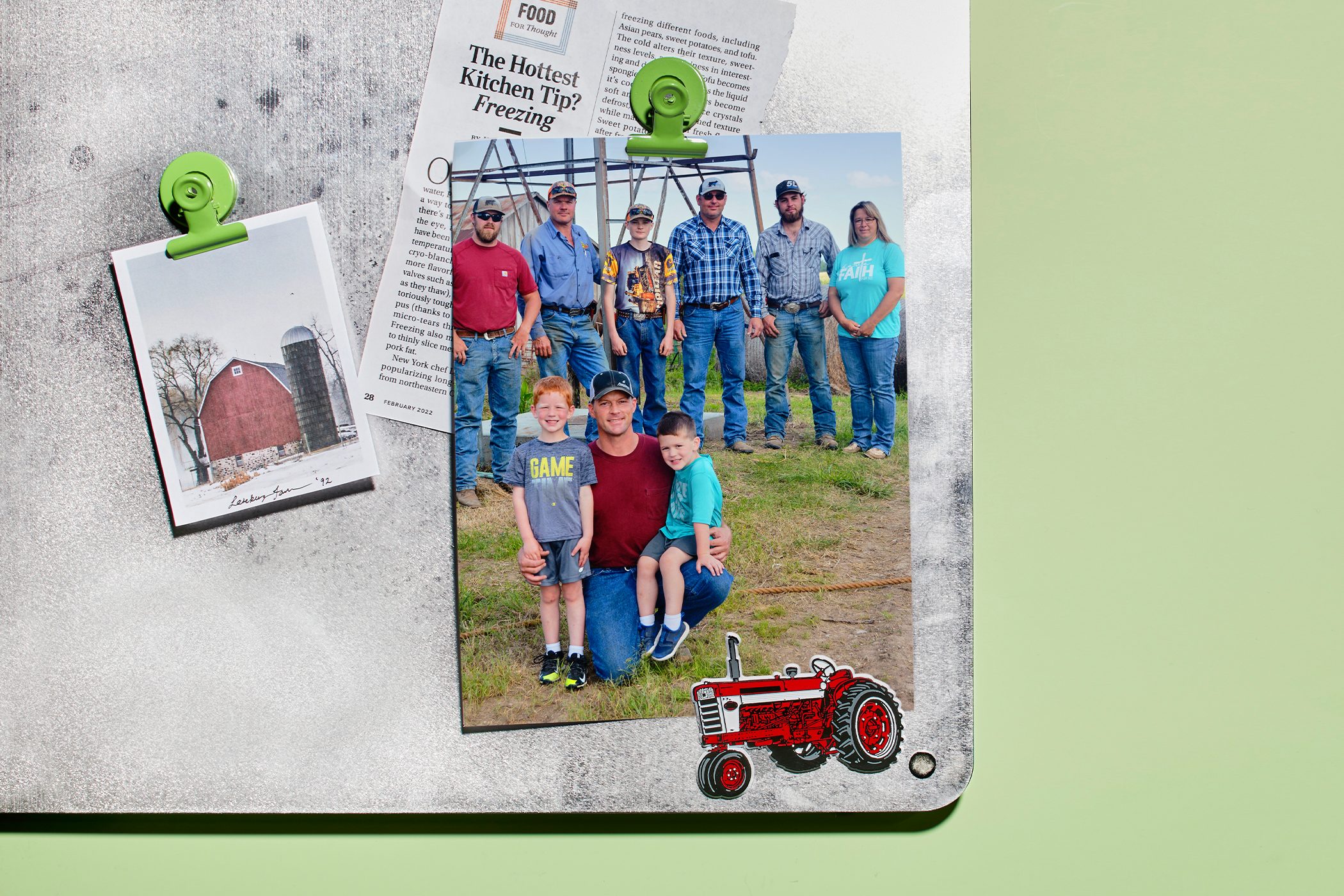 Photos clipped on a textured board show a family posing outdoors and a red barn landscape. A newspaper headline reads, 