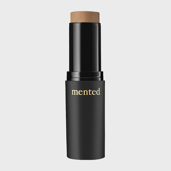 A lipstick tube stands upright with 