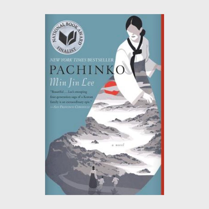 A woman in traditional attire stands, overlooking a stylized mountain landscape; book cover reads 