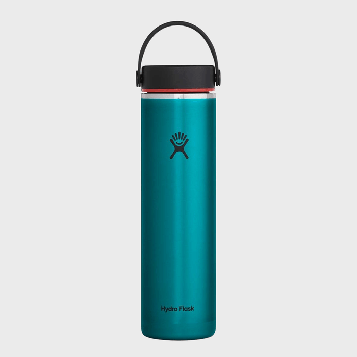 A teal water bottle stands upright; features a black cap with a handle, logo and 