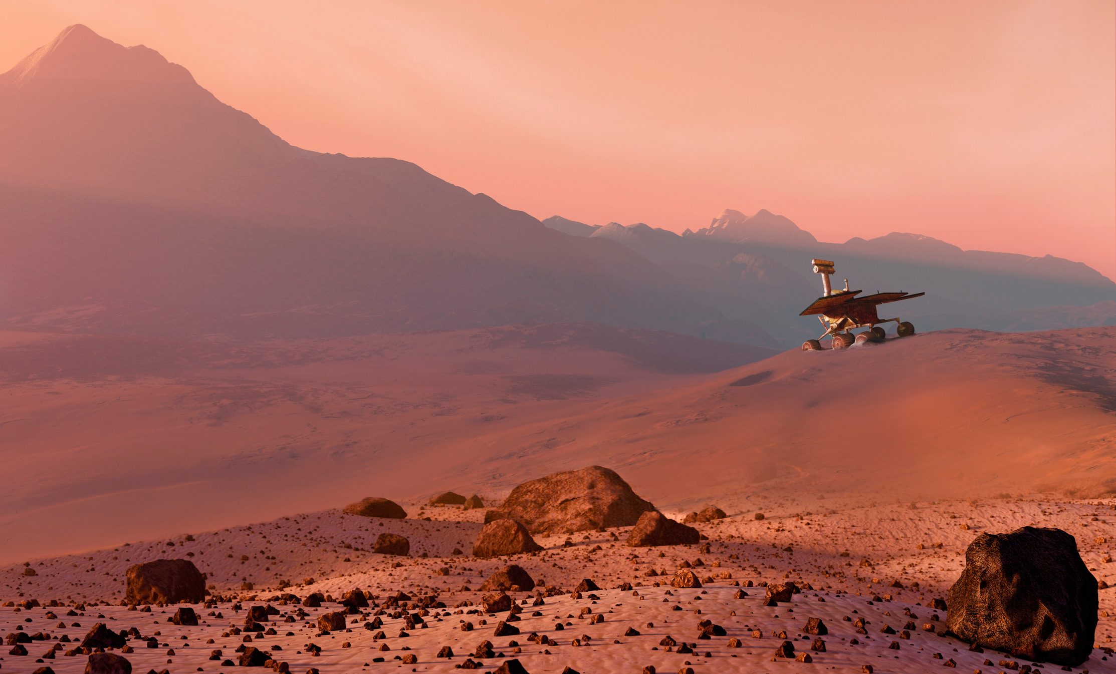 Rover explores dusty, rocky terrain with distant mountains under a pink sky.