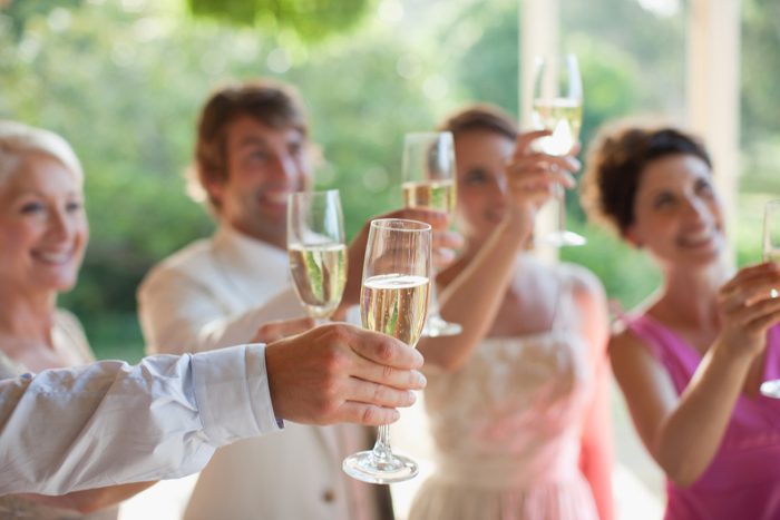 Guests toasting with champagne at wedding reception