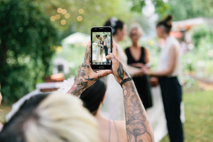 Woman taking photo at Wedding