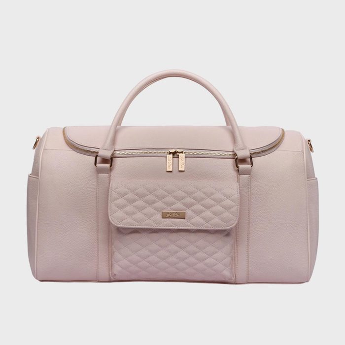 A pink duffle bag with quilted front pocket, gold zippers, and dual handles, set against a plain white background.