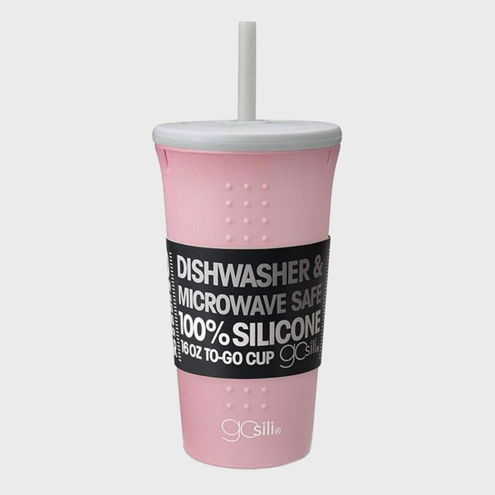 A pink silicone cup with a white lid and straw stands against a neutral background, labeled as dishwasher and microwave safe, 16oz capacity.
